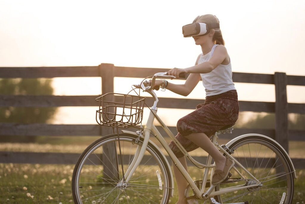 girl on bycicle wearing VR-headset